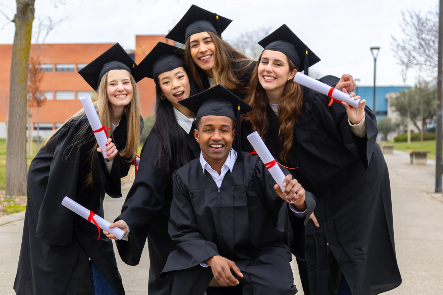 happy-multiethnic-students-celebrating-graduation-2025-03-05-05-10-23-utc-1536x1024.webp