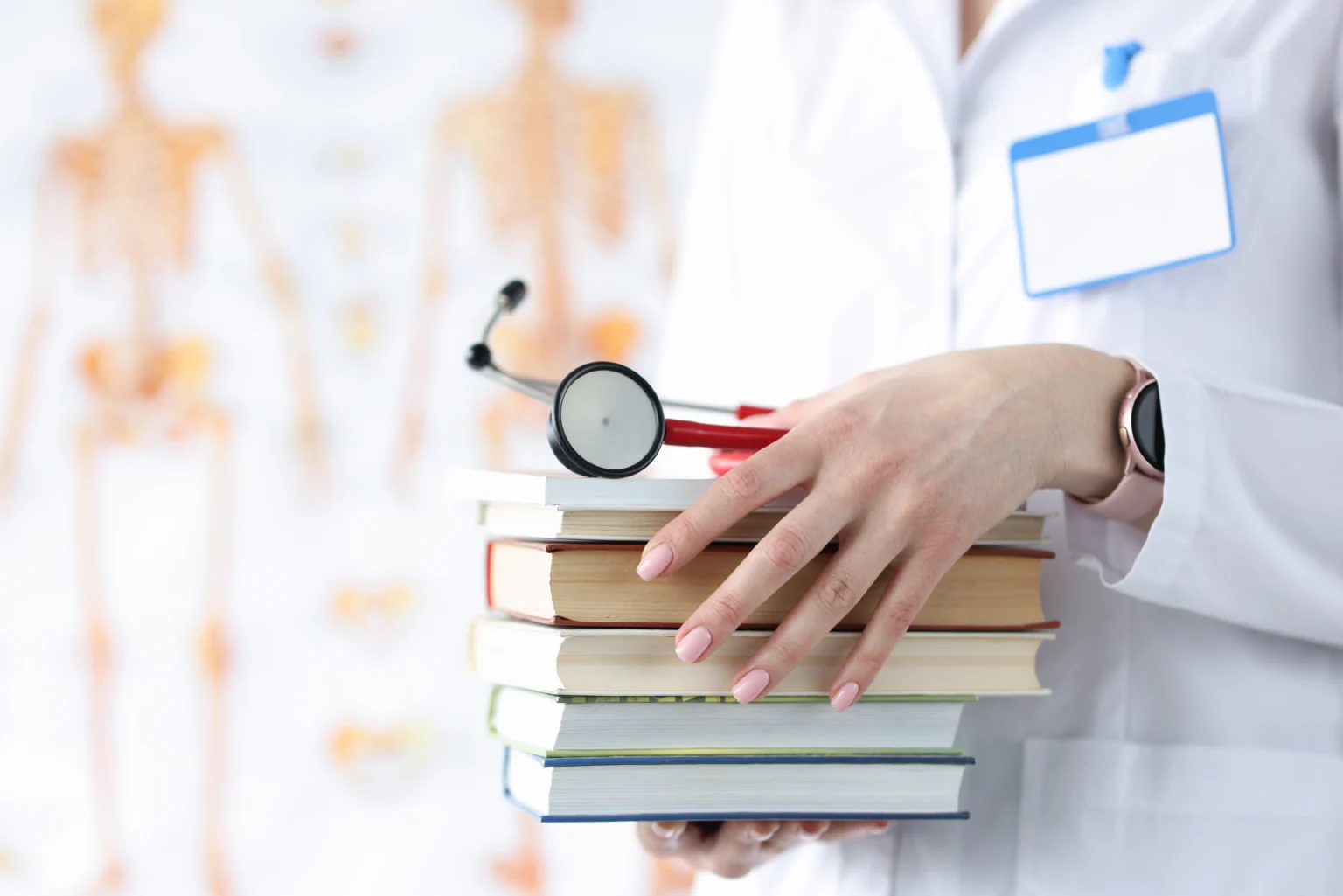 doctor-hands-are-holding-stack-books-stethoscope-1536x1025.webp